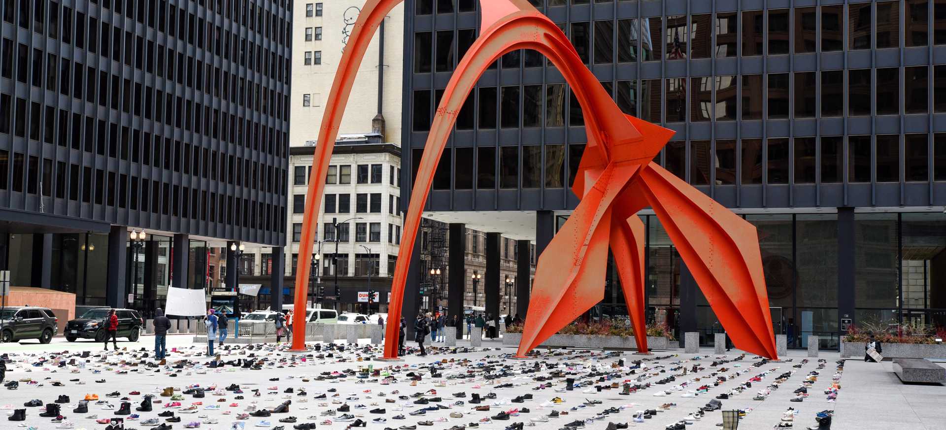 An image of Chicago's Daley Plaza, filled with shoes that are spaced evenly representing the dead of Gaza